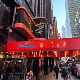 people walking down the sidewalk