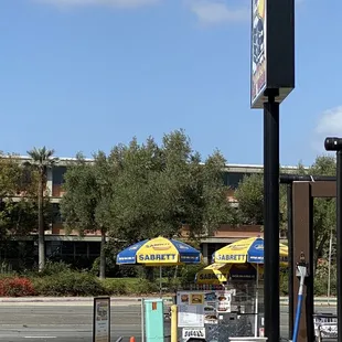 a gas station with a sign for a pet store