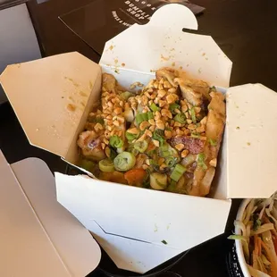 a take out box of chinese food