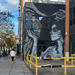 a woman walking down the sidewalk