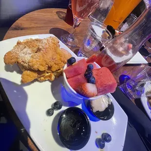 Chicken and waffles. Comes with one small waffle and 3 chicken tenders. The mixed fruit has pineapple so if your allergic let them know.