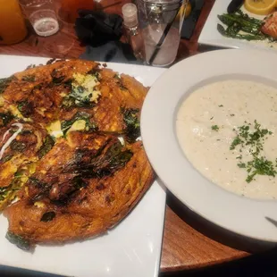 Shrimp and spinach omelet with grits on the side.