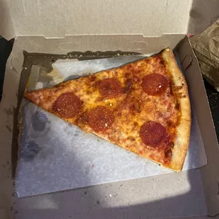 a slice of pepperoni pizza