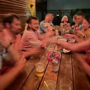 a large group of people sitting at a table