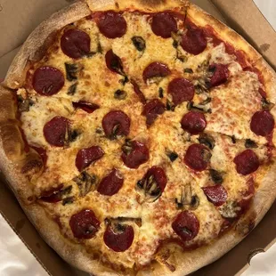 a pepperoni pizza in a box