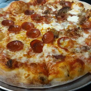 Half pepperoni and meat pizza