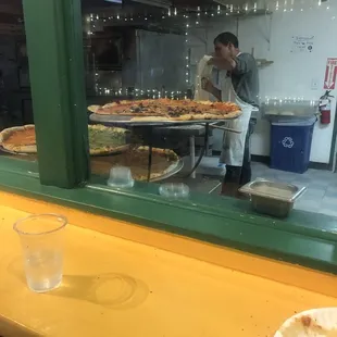 Pizza w dope guy who made it in background