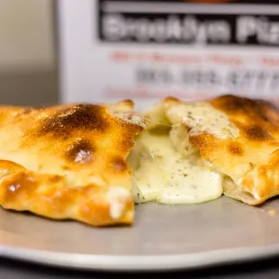 a half eaten pizza on a plate