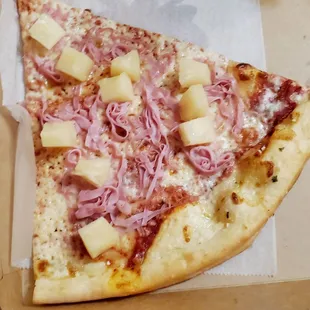 Red sauce based slice with ham and pineapple.