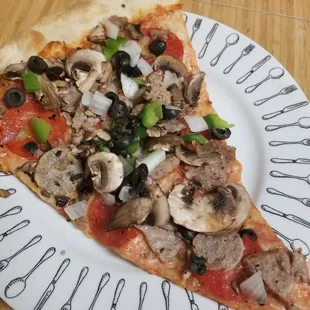 Ordered in. Their Brooklyn Special slice! I had to fold it. Amazing toppings