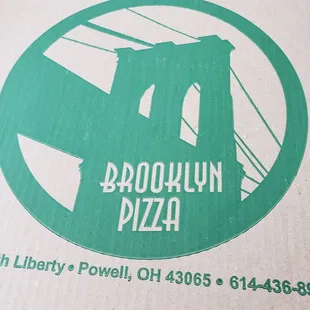 a box with the brooklyn pizza logo on it