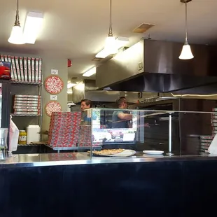 Amazing, tasty, cheap pizza that's hand tossed right in front of you!