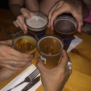 a group of people drinking beer