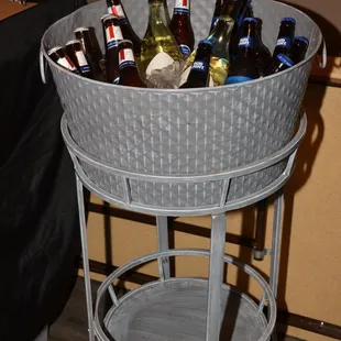 a bucket full of beer bottles