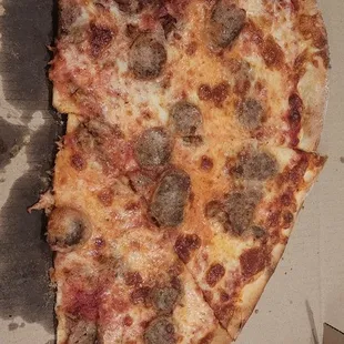 Sausage and half bacon pizza