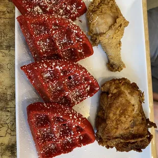 a plate of waffles and fried chicken