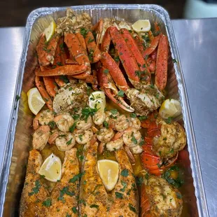 Crab legs, Salmon, Lobster tail, and Jumbo Shrimp.