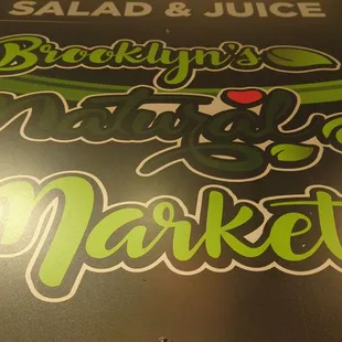 a sign for salad and juice