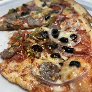 two slices of pizza on a plate