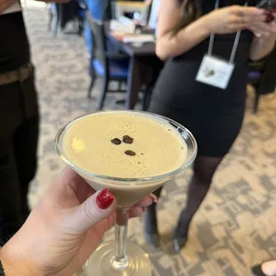 a woman holding a martini glass