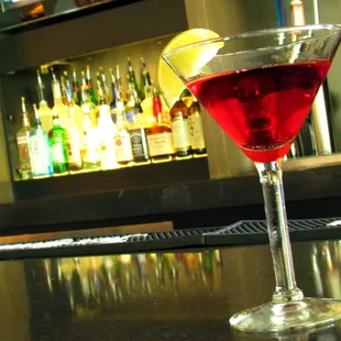 a martini with a lemon wedge