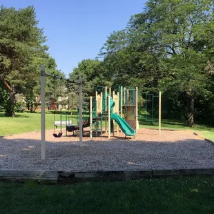 Play Area with Swings and Two Benches