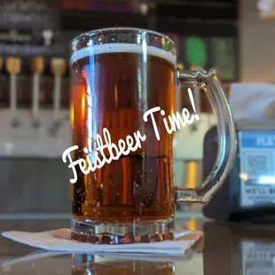 a glass of beer on a table