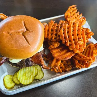 a burger and sweet potato fries