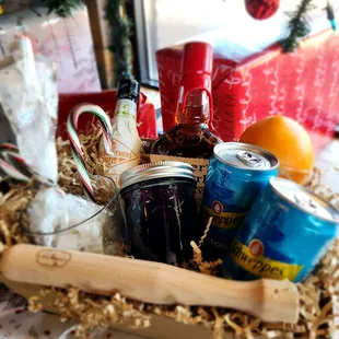 a basket of drinks and snacks