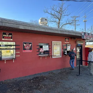 You place your order on the right side and pick it up on the left. You use to be able to go inside to order but I guess that's a wrap.