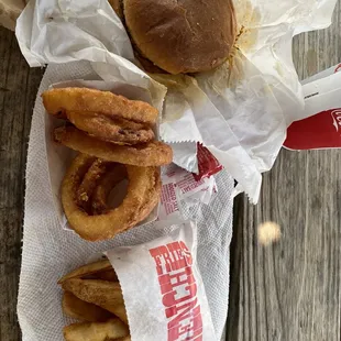 Onion rings, fries and hamburger
