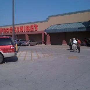 a man riding a horse in front of a store