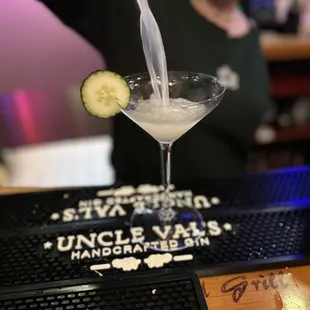 a bartender pouring a drink
