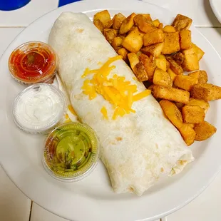 a burrito, fries, and condiments