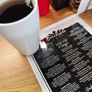 a cup of coffee and menu