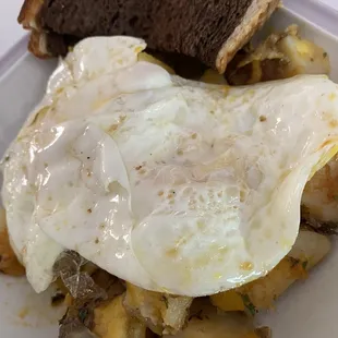 Breakfast Bowl with over medium eggs and rye toast