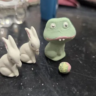 Close uo of the bunnies, frog and strawberry.