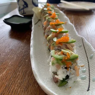 a long plate of sushi