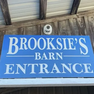 a sign for brooksie&apos;s barn entrance