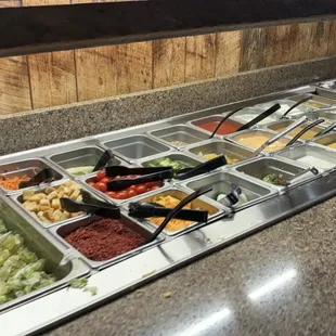 a buffet with a variety of food items