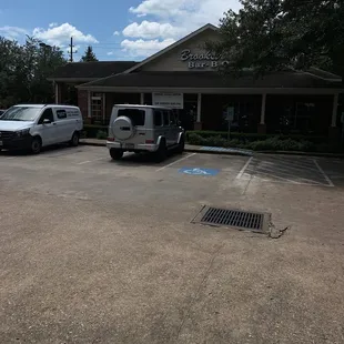 two cars parked in a parking lot