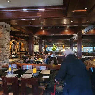 people sitting at tables in a restaurant