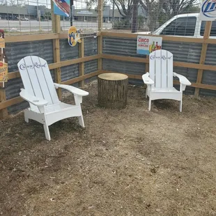 two adiron chairs and a table