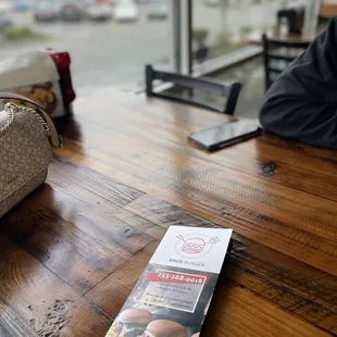 a menu on a wooden table