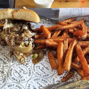 Philly cheese burger and sweet potato fries. Over-stuffed and amazing!