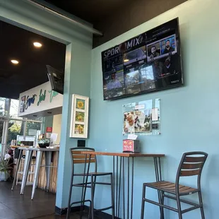 TV, some seats with the counter on the other side