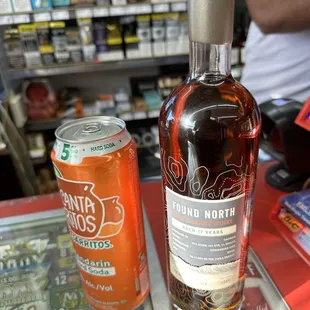 a bottle and a can on a table