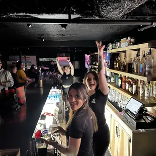 a group of people at a bar