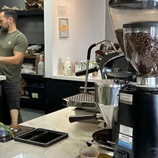 The main barista and his workstation.