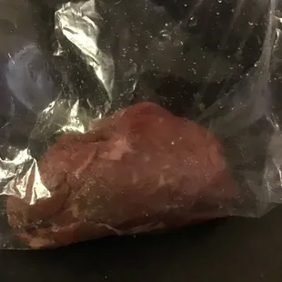 Raw steak in the bag